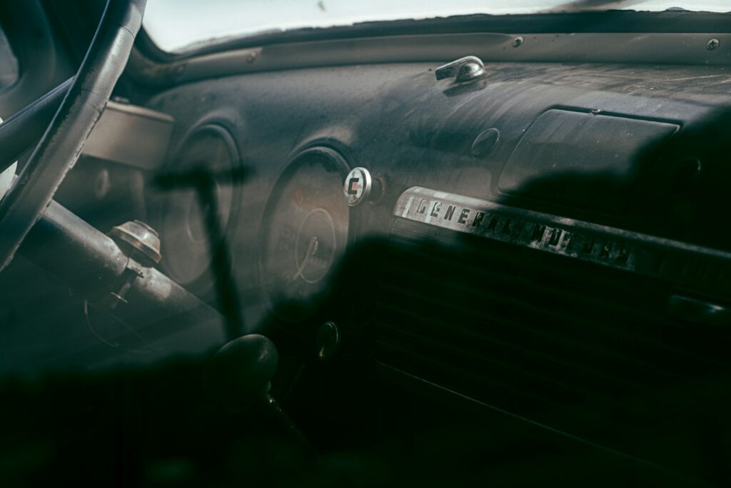 a close up of a steering wheel and dashboard of a car